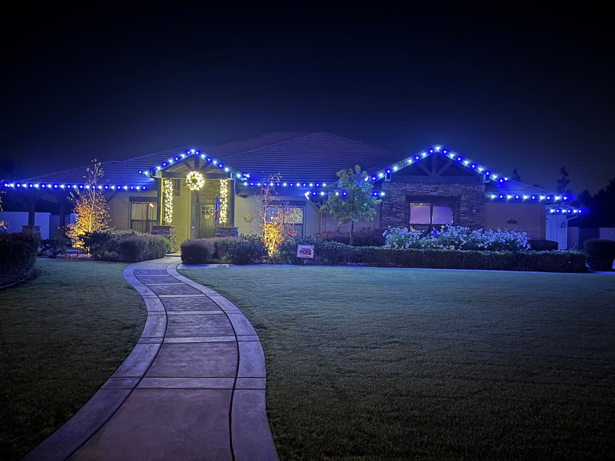 Blue Roofline with Warm White Accents. Christmas light installation by Bright Idea Christmas Lights.