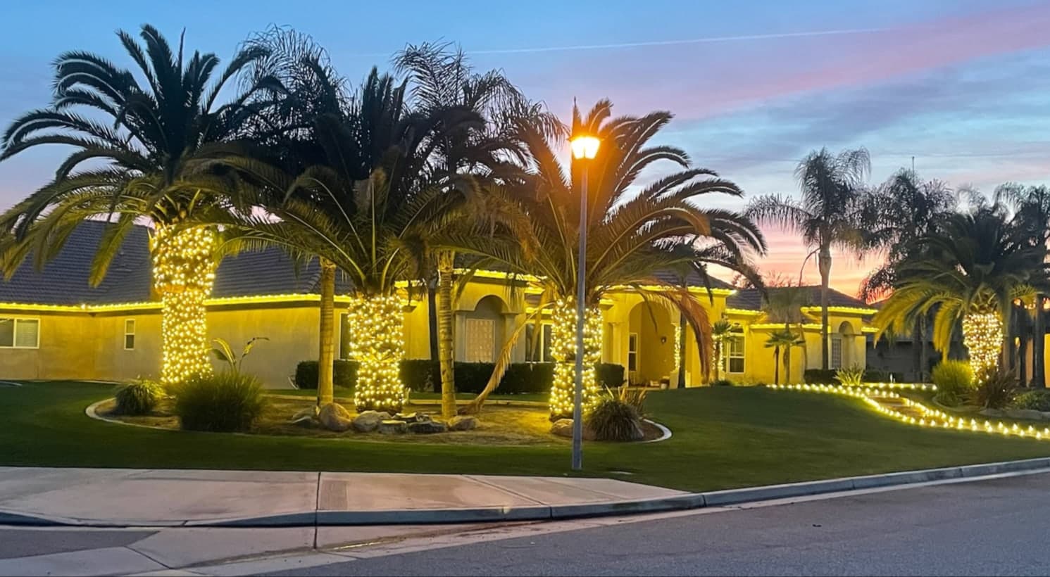Elegant Soft White Lighting with C9 Bulbs. Christmas light installation by Bright Idea Christmas Lights.