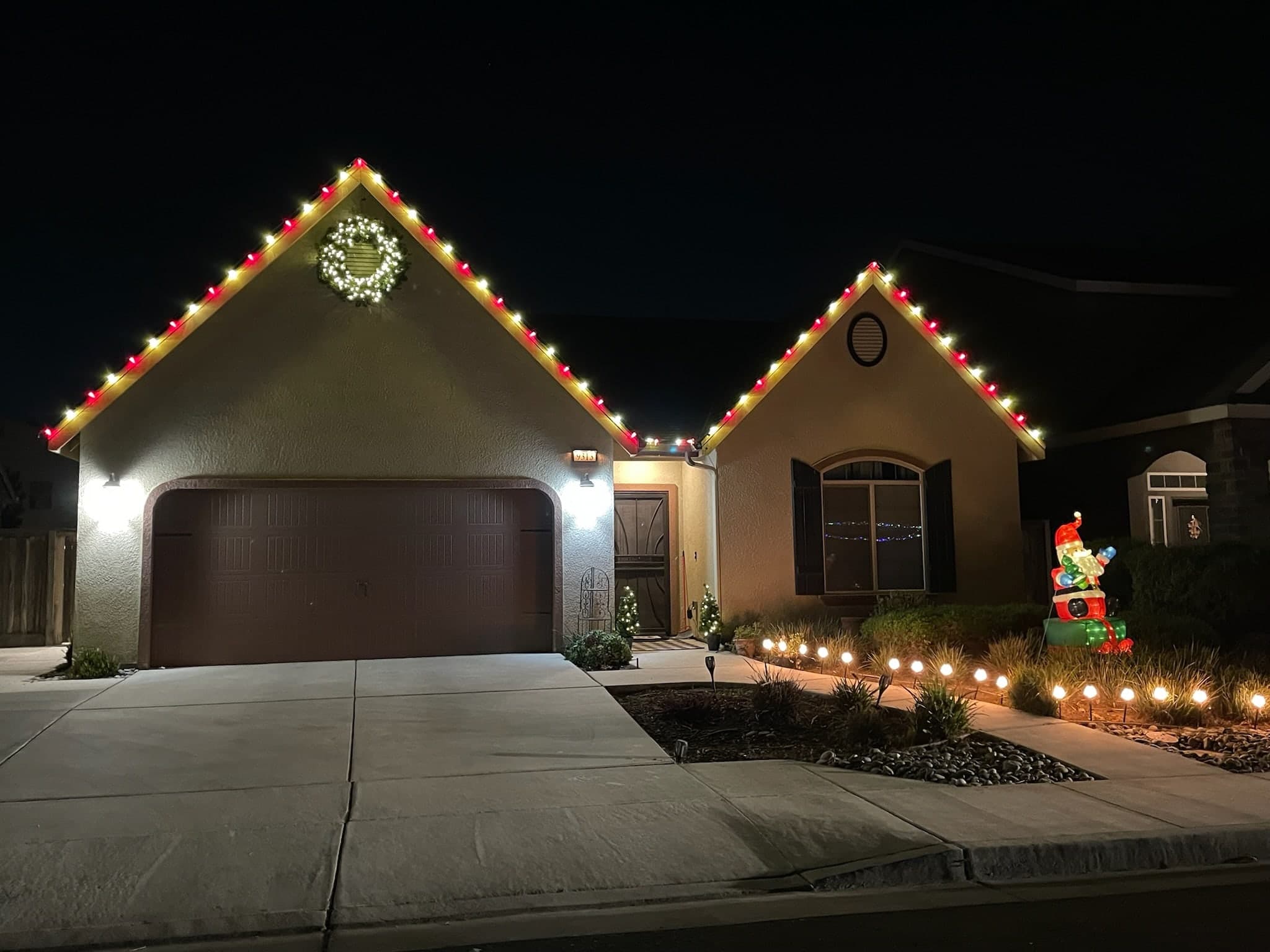 Red and White Roof Line, "Gingerbread House" Style. Christmas light installation by Bright Idea Christmas Lights.