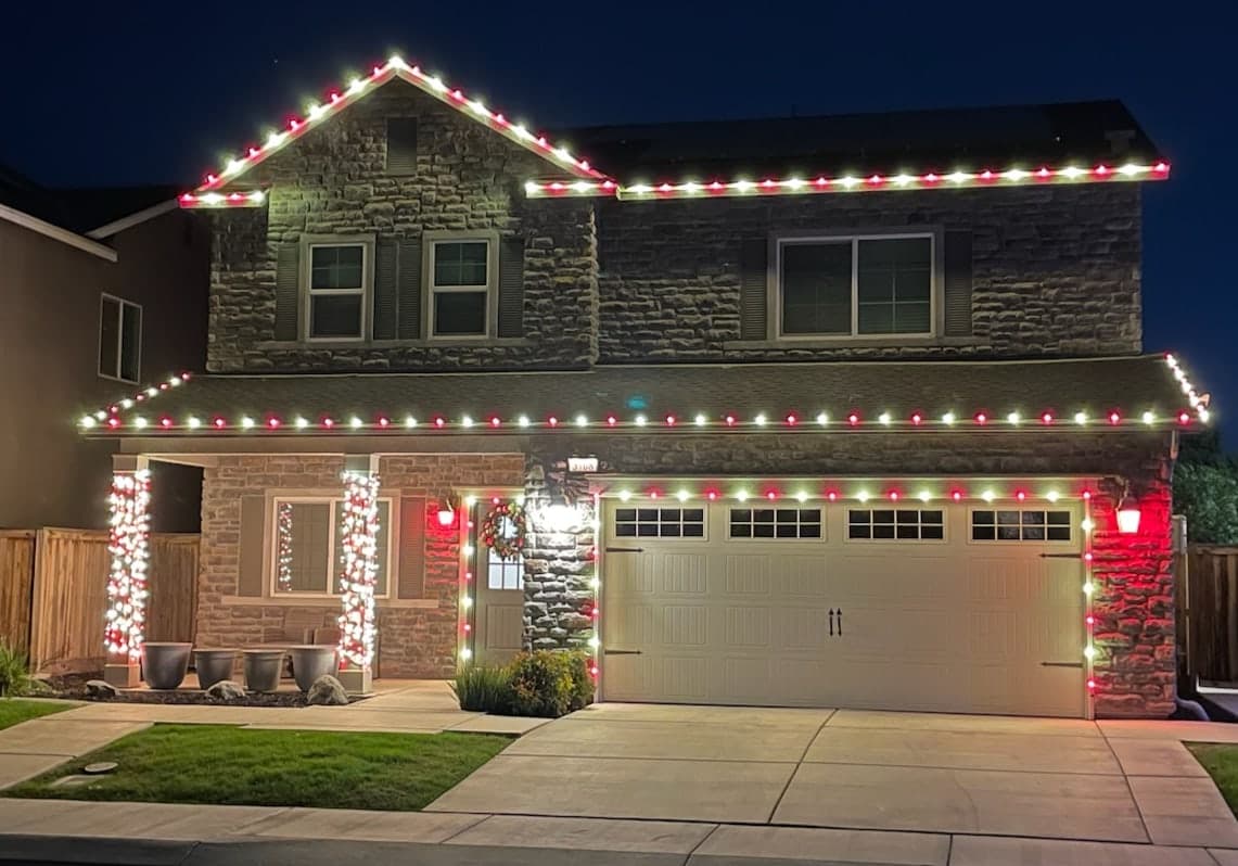 Red and White Roofline, Garage, Door and Pillars. Christmas light installation by Bright Idea Christmas Lights.