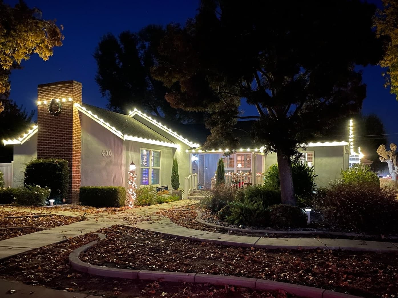 Warm White C9 Bulbs on Roof Line. Christmas light installation by Bright Idea Christmas Lights.